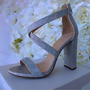Silver shimmering heels with rhinestones.